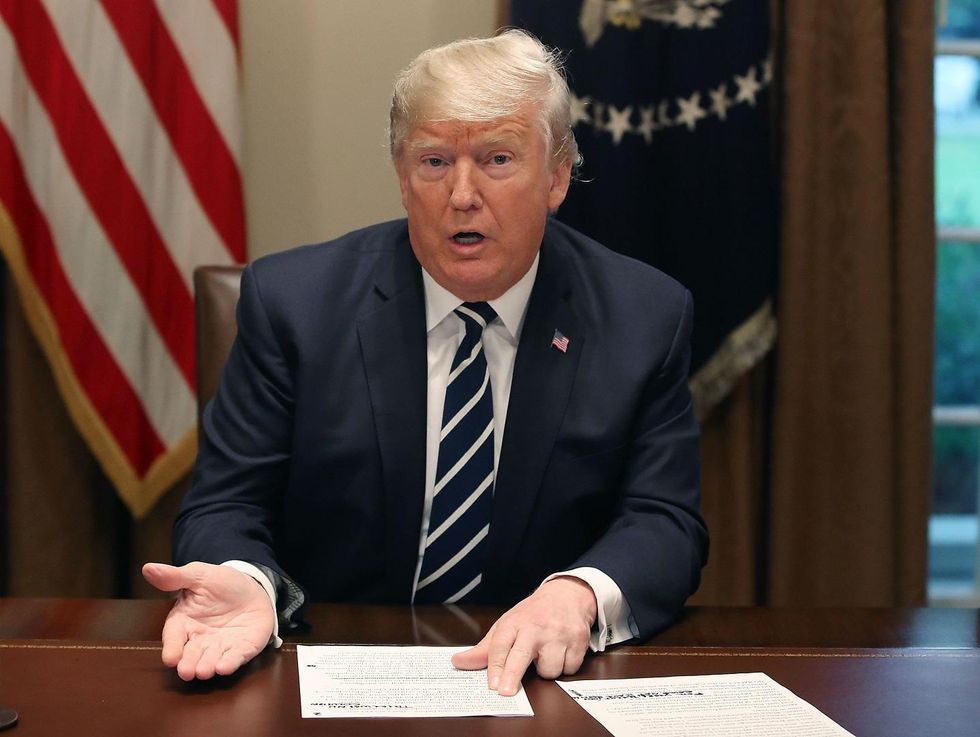 Trump changes his words, says he meant to say he believed US intel that Russia interfered in 2016