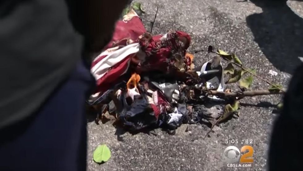 Maxine Waters' supporters burn US flag outside her LA office in counter-protest to Oath Keepers
