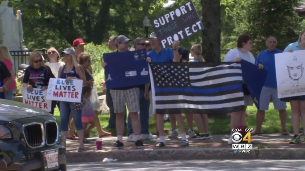 Blue Lives Matter rally held for murdered cop; police investigate ominous image day of cop's wake
