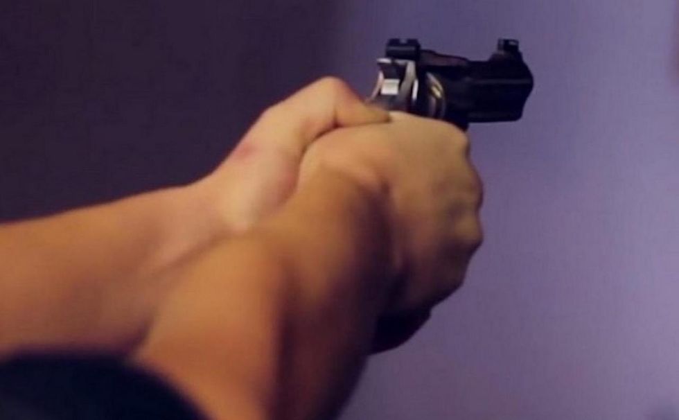 Woman's abusive husband threatens her with a gun. But she's also armed — and pulls the trigger.