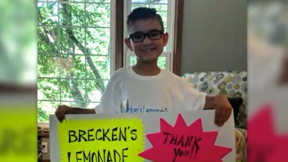 Cancer survivor, just 8 years old, starts lemonade stand to benefit his local police department