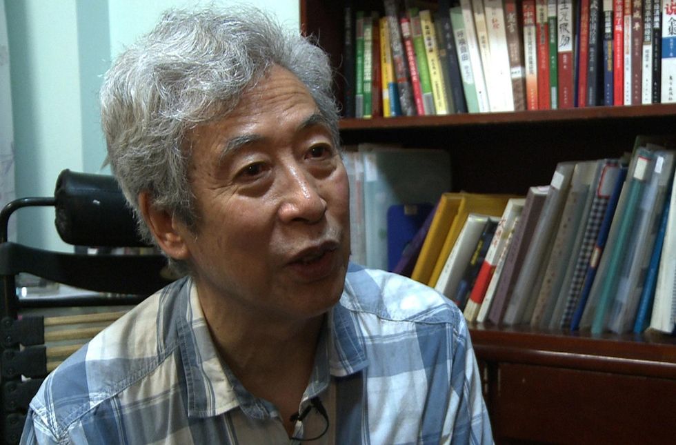 Chinese police arrest dissident during an interview where he questioned government policies