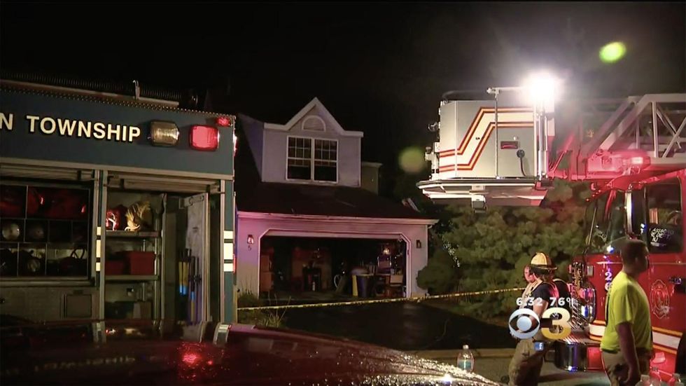 Man braves house fire's flames to save the lives of his neighbor and two young children