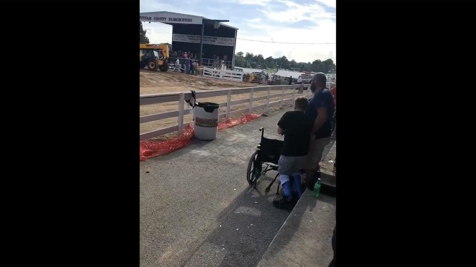Viral video shows wheelchair-bound boy stand for national anthem at Tennessee fair
