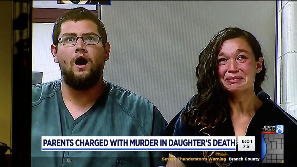 Parents charged with baby's murder. Police say they refused to get help for religious reasons.