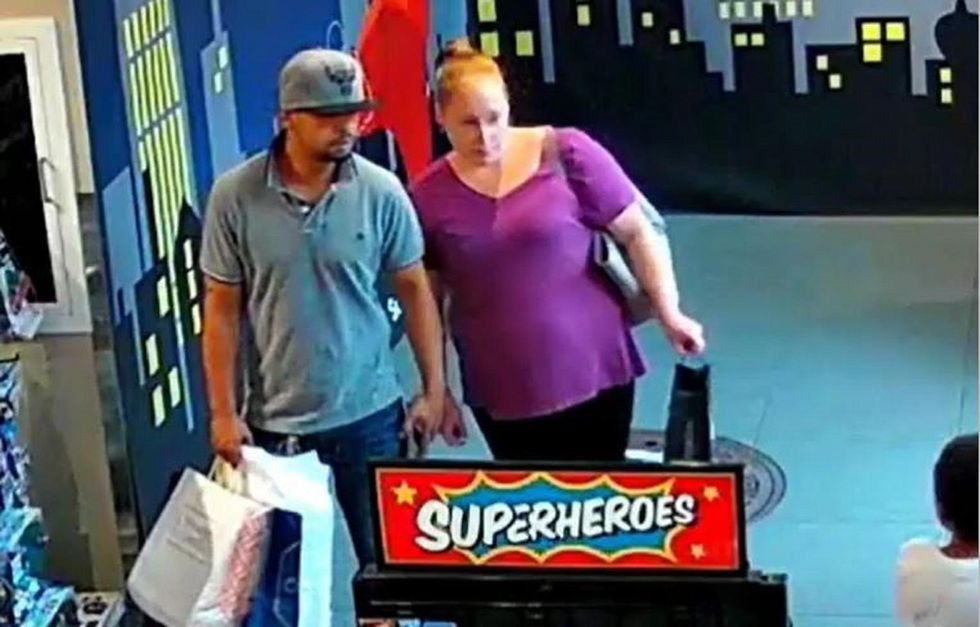 Massachusetts police hunt for couple who robbed toy store with a child in tow