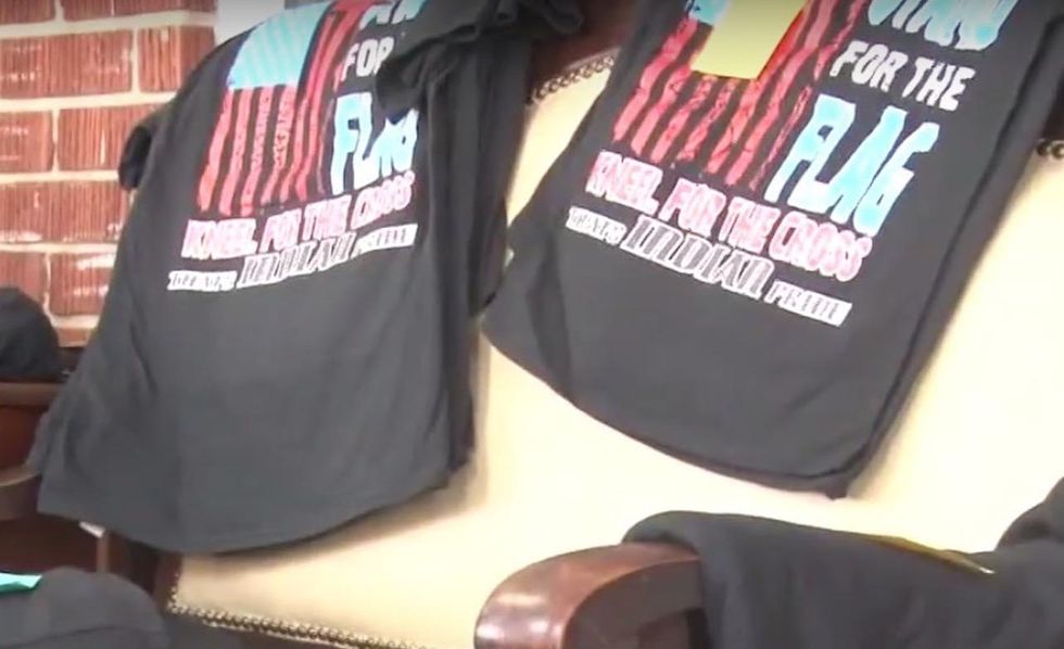 'We stand for the flag': T-shirt for HS cheerleaders' team called 'politically divisive'—even racist