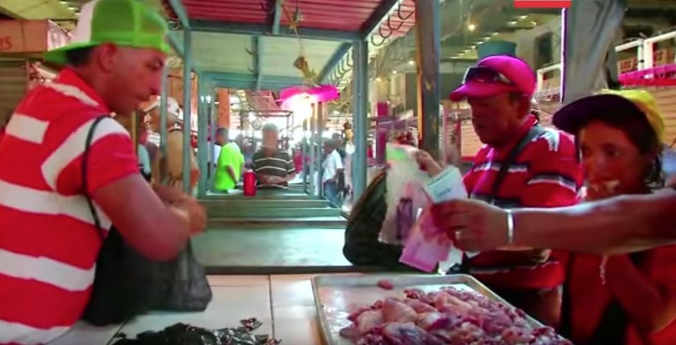 Desperate Venezuelans are forced to eat rotten meat for two terrible reasons