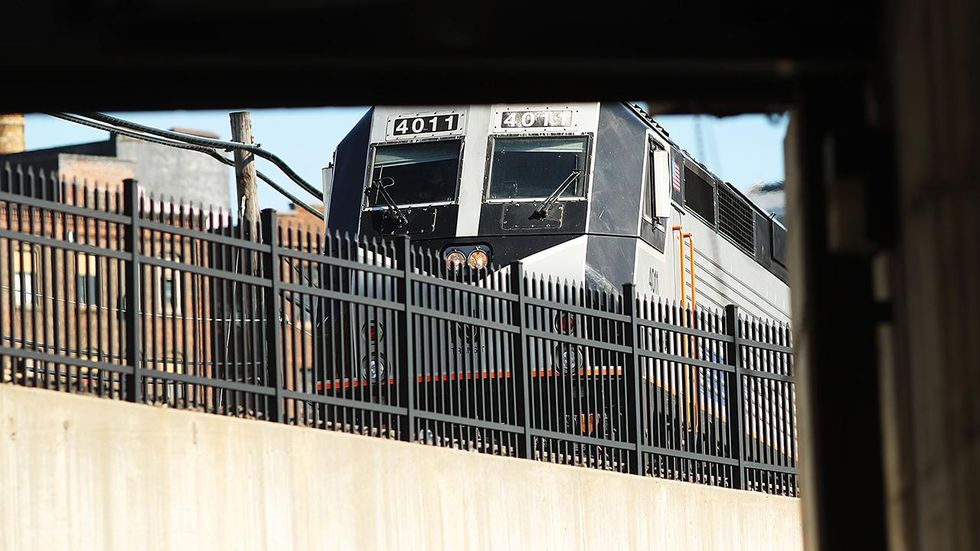 Family says security footage shows cop 'threw' their son in front of oncoming train, killing him
