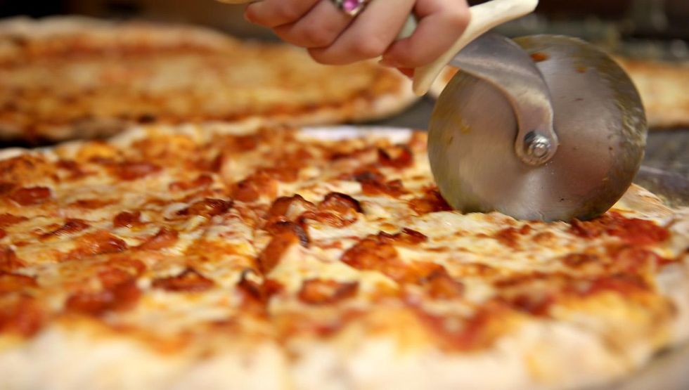 British government plans to fight obesity by capping the calories allowed in a pizza, other foods