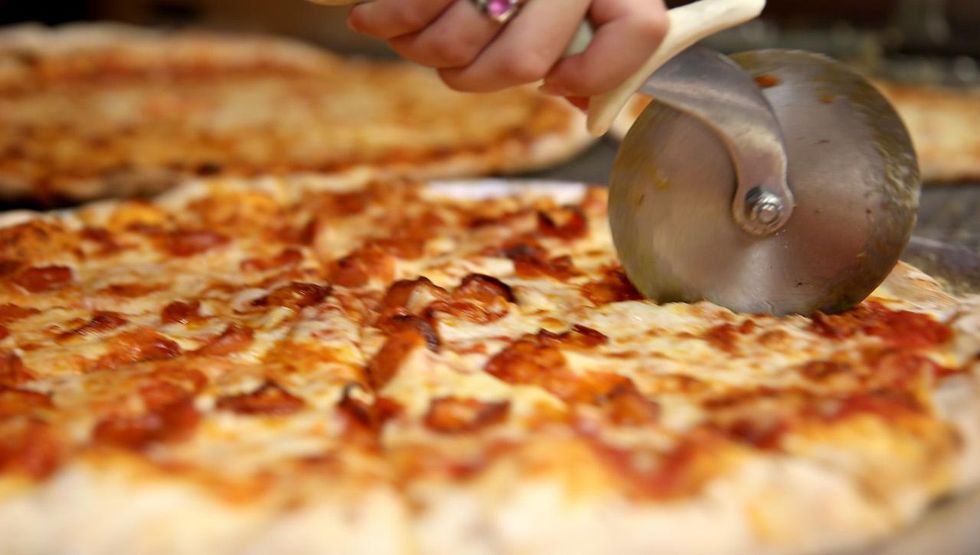 British government plans to fight obesity by capping the calories allowed in a pizza, other foods
