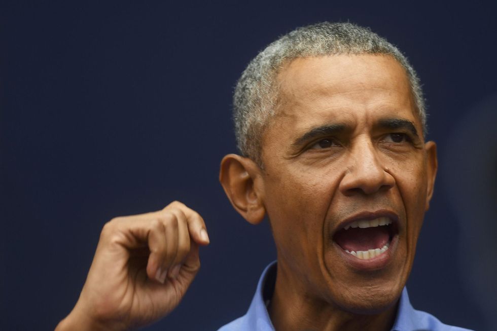 Obama unleashes torrent of insults and mockery against Trump at Democrat rally