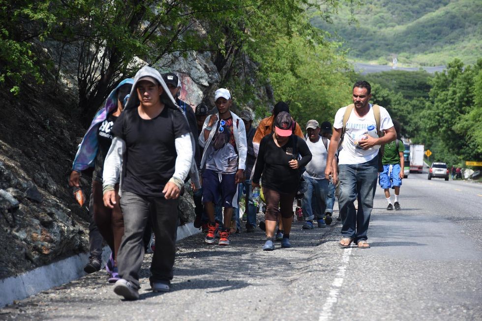 One dead, dozens injured as migrant caravan clashes with Mexican authorities