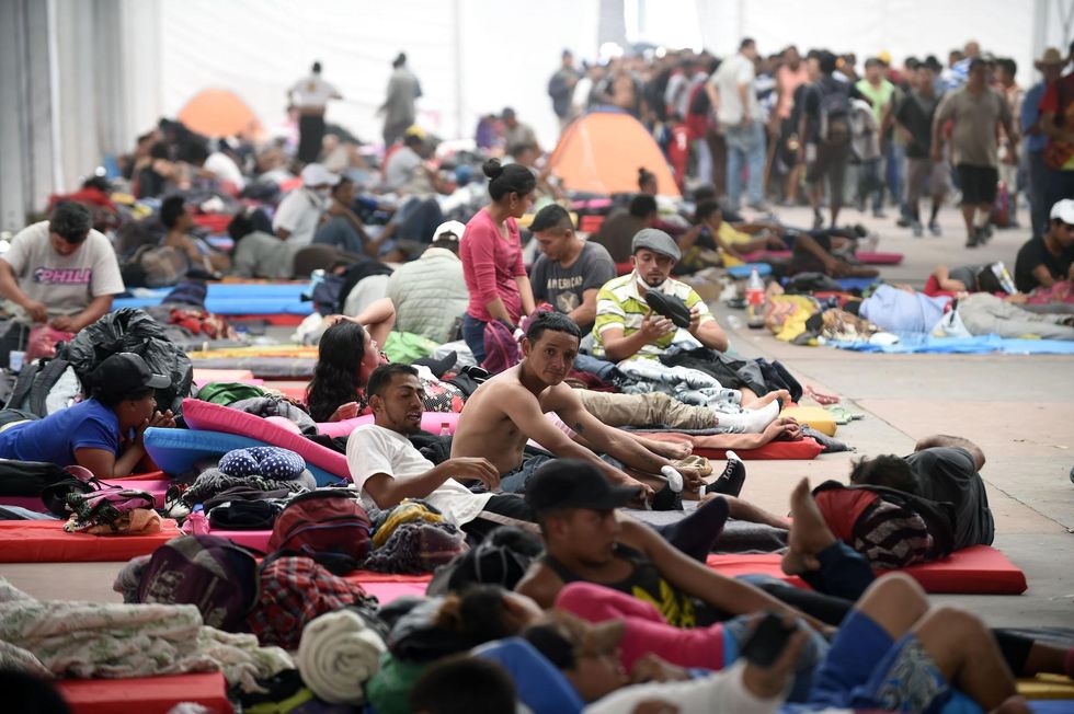 Thousands of caravan migrants are arriving to a Mexico City stadium - here's what it looks like