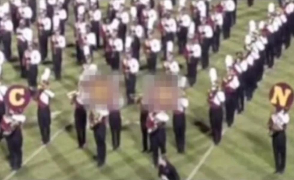 HS marching band members spell out racial slur at game. Then races of guilty parties are revealed.
