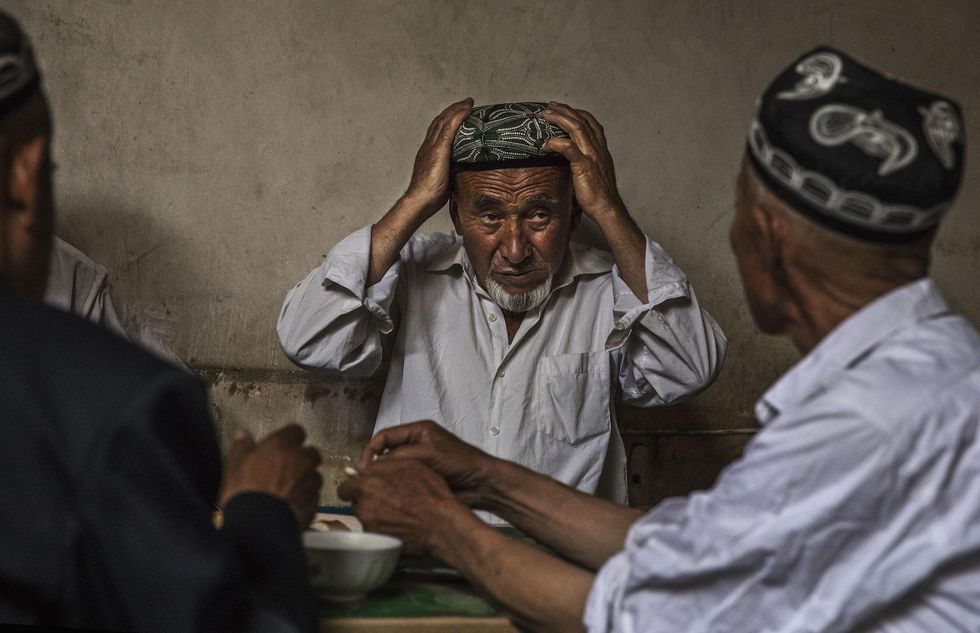 China dismisses reports about its indoctrination camps as 'gossip