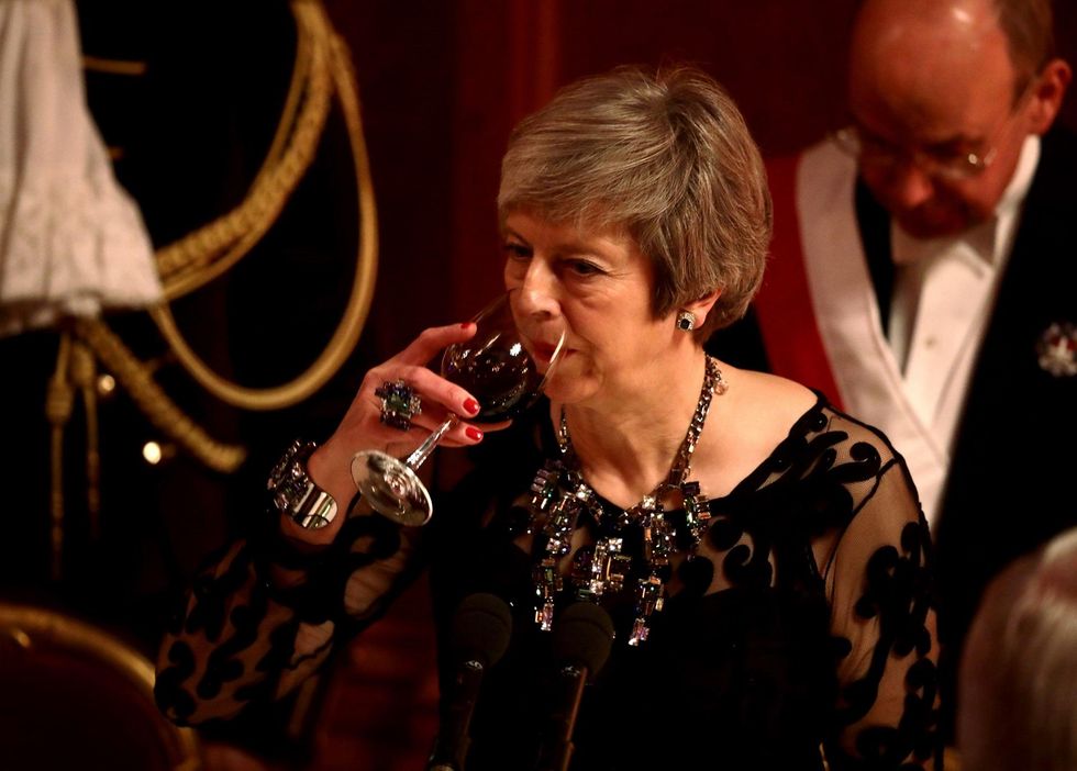 Brexit deal drawn up between UK and EU, while Theresa May faces tough opposition at home