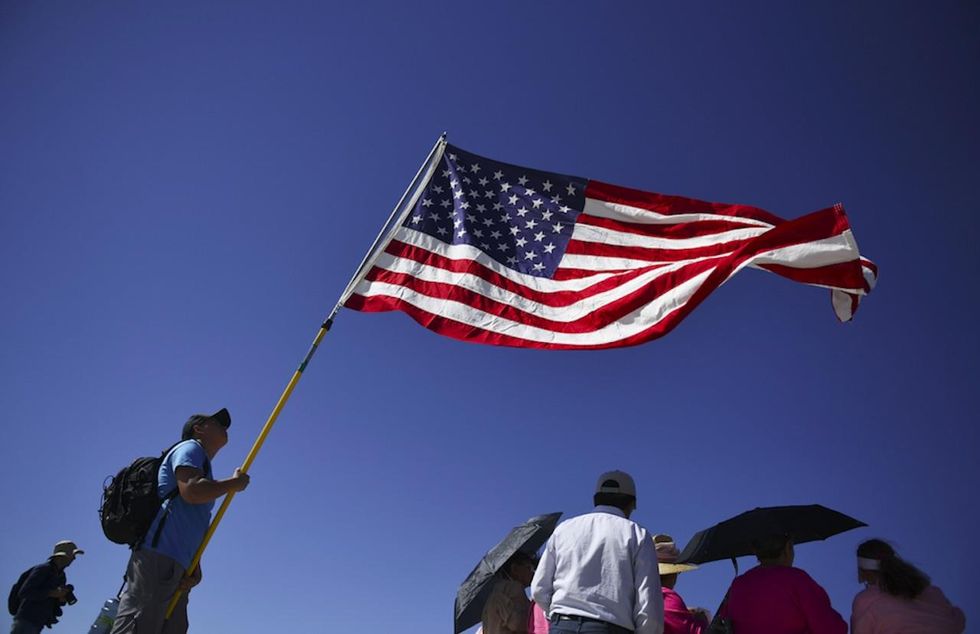 School: Teacher bullied students who refused to stand for pledge—by thanking students who did stand