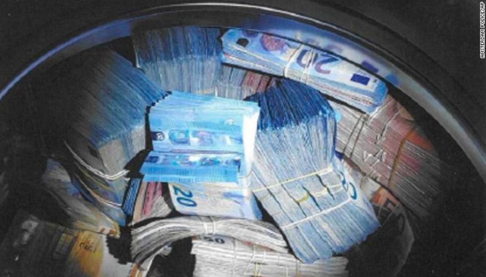 Man accused of money-laundering after authorities find $400,000 in washing machine