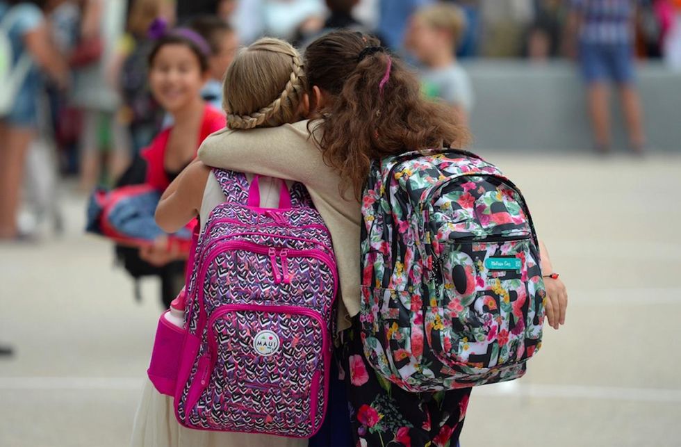 Mom says her middle school girl hugged upset student—and was disciplined under 'level one offenses\