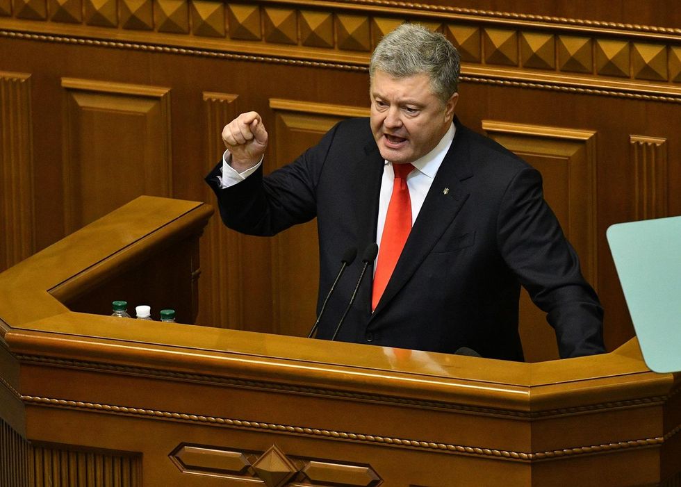 Ukraine imposes travel, financial restrictions on Russian citizens as martial law takes effect