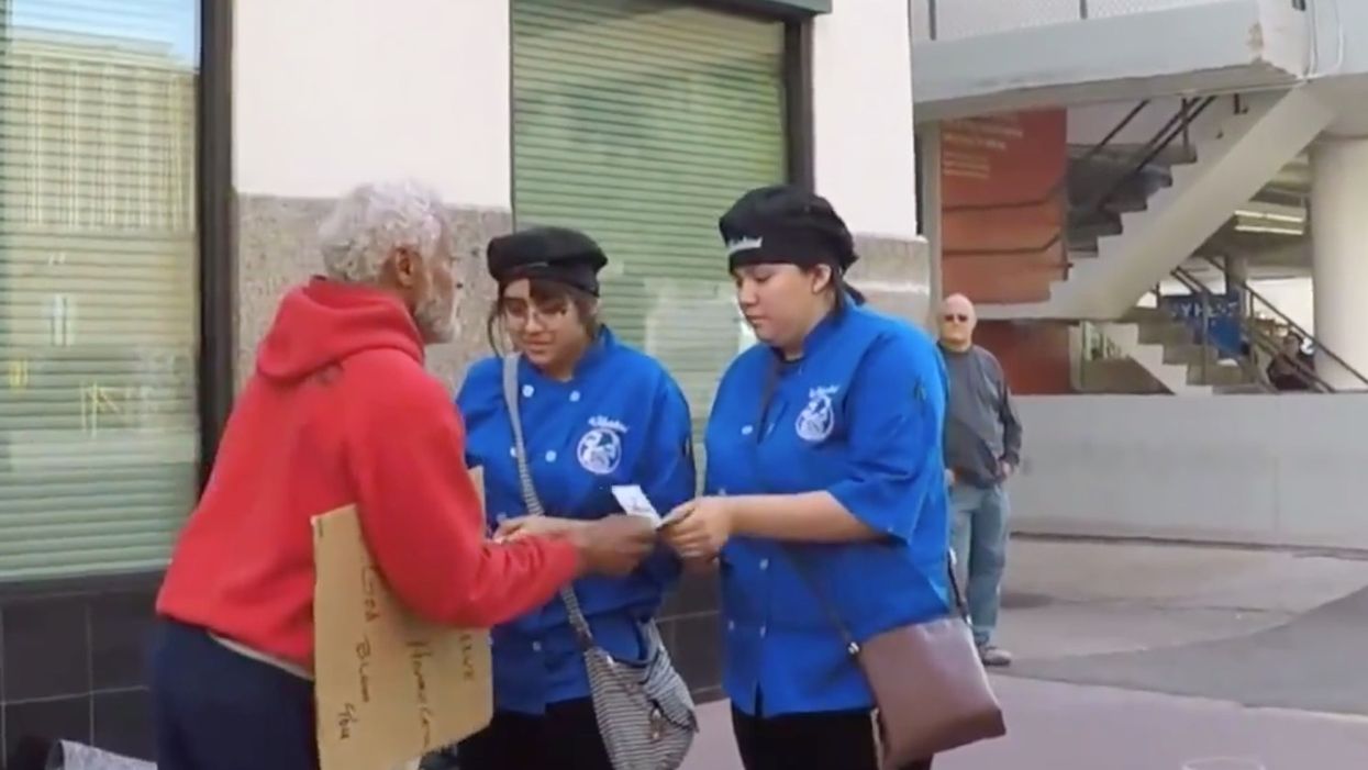 Secret Santa enlists an unusual elf to pass out thousands of dollars