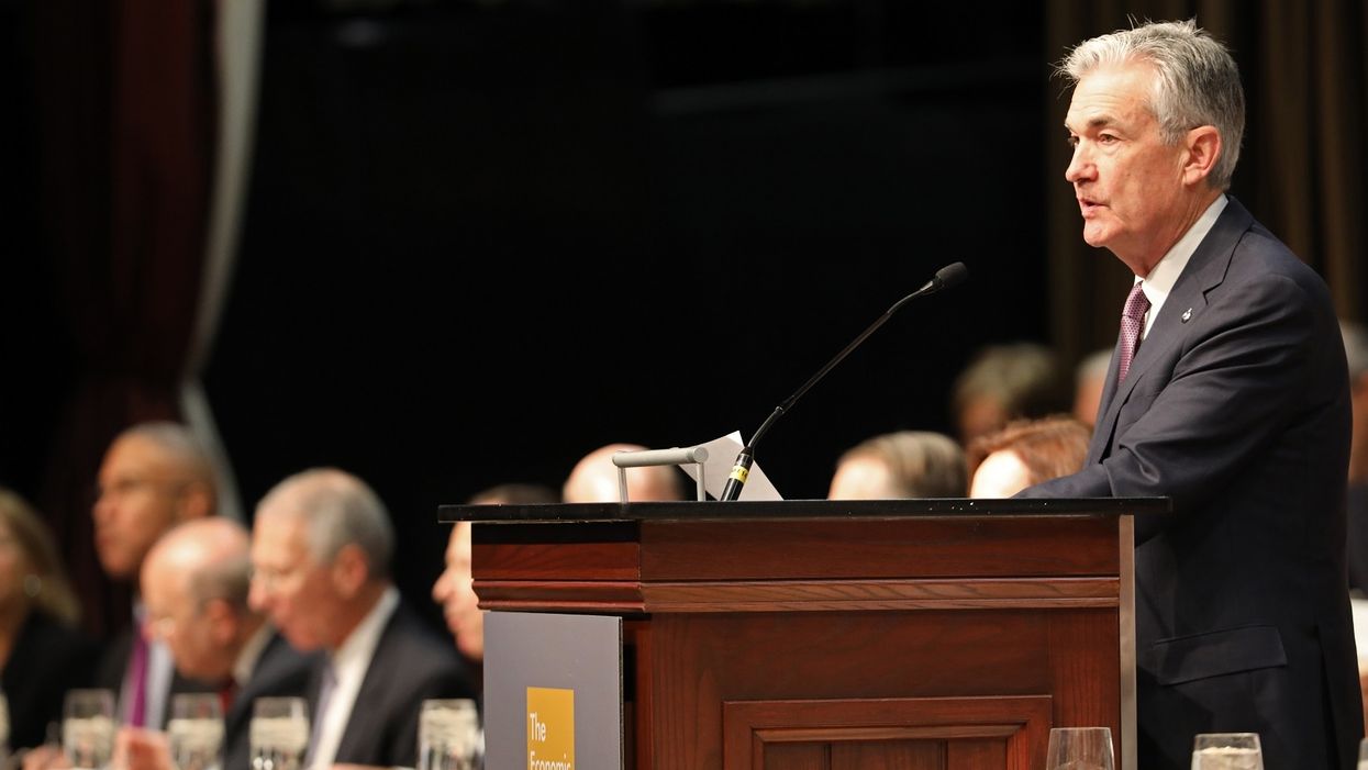 Despite Trump's warning, Federal Reserve raises interest rates