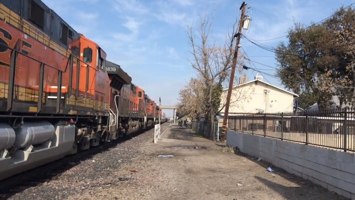 Girl, 8, killed by train after mother told her to crawl under it to get to bus stop on time, police say