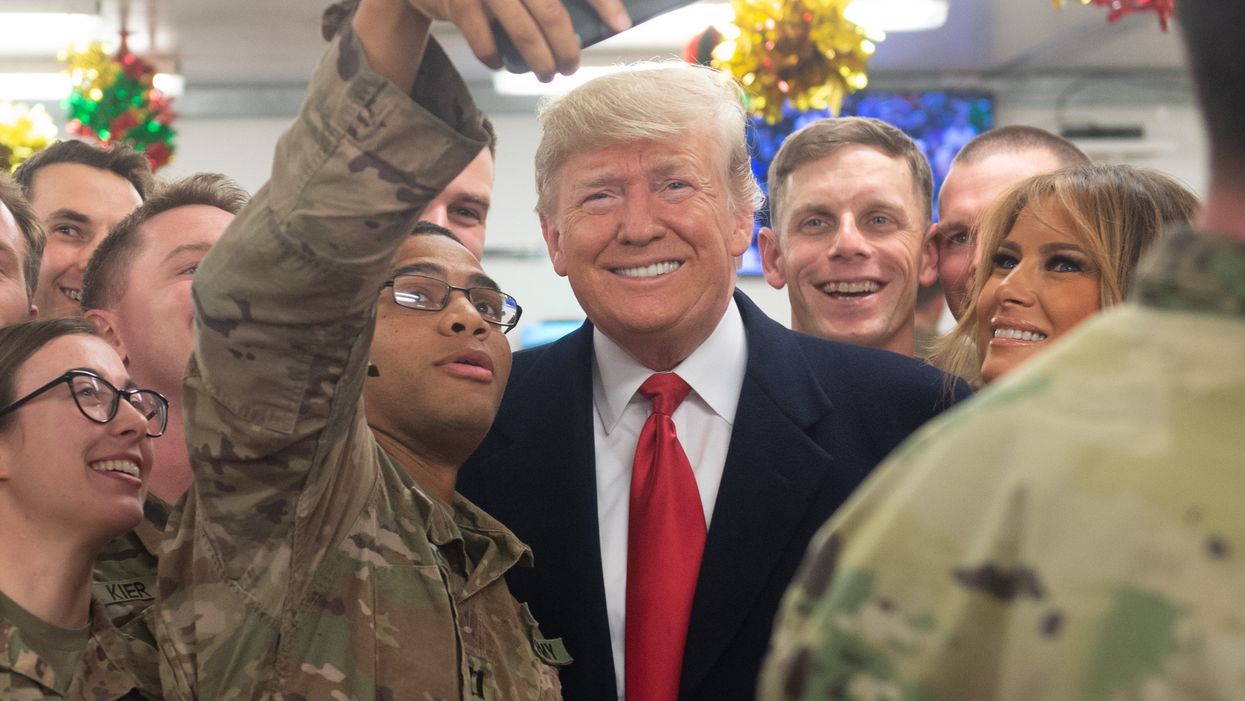Trump responds to 'Fake News Universe' criticism of him signing MAGA hats for troops