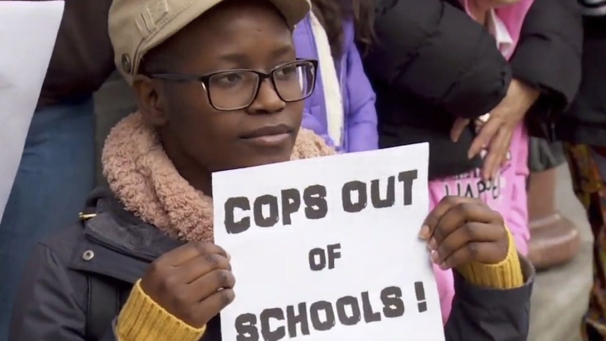 Public school students walk out of class to protest the presence of police officers on campus
