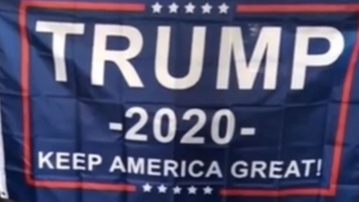 Trump banner held by white fans at HS basketball game angers black coach — so district is investigating