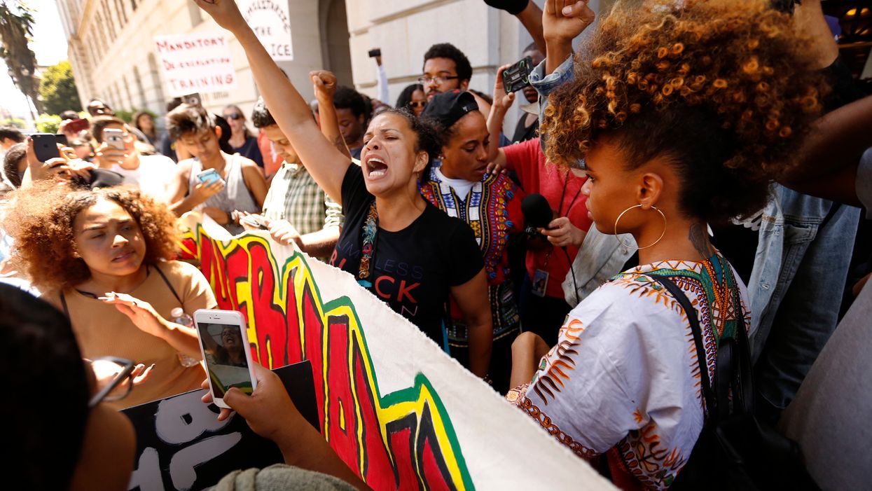 Black Lives Matter leader charged with battery on a police officer. She says charges are ‘attempt to criminalize Black protest.’