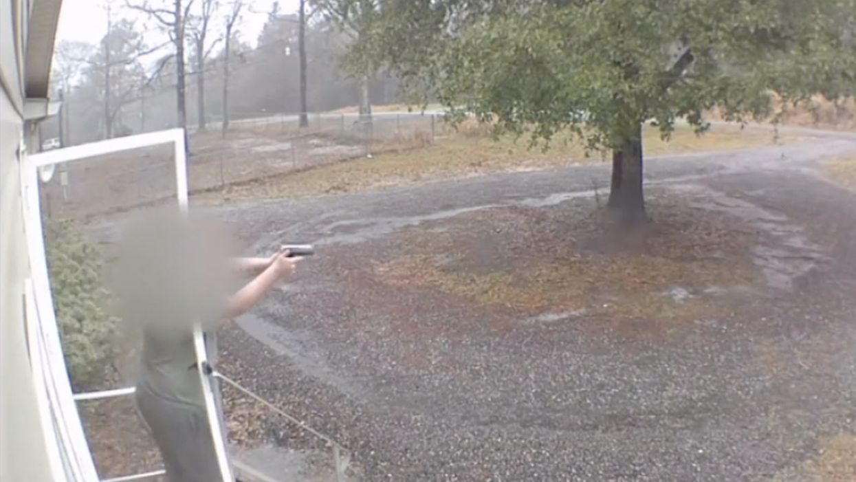 Creep tries kicking down front door. Woman in house warns she has a gun — and proves it seconds later.