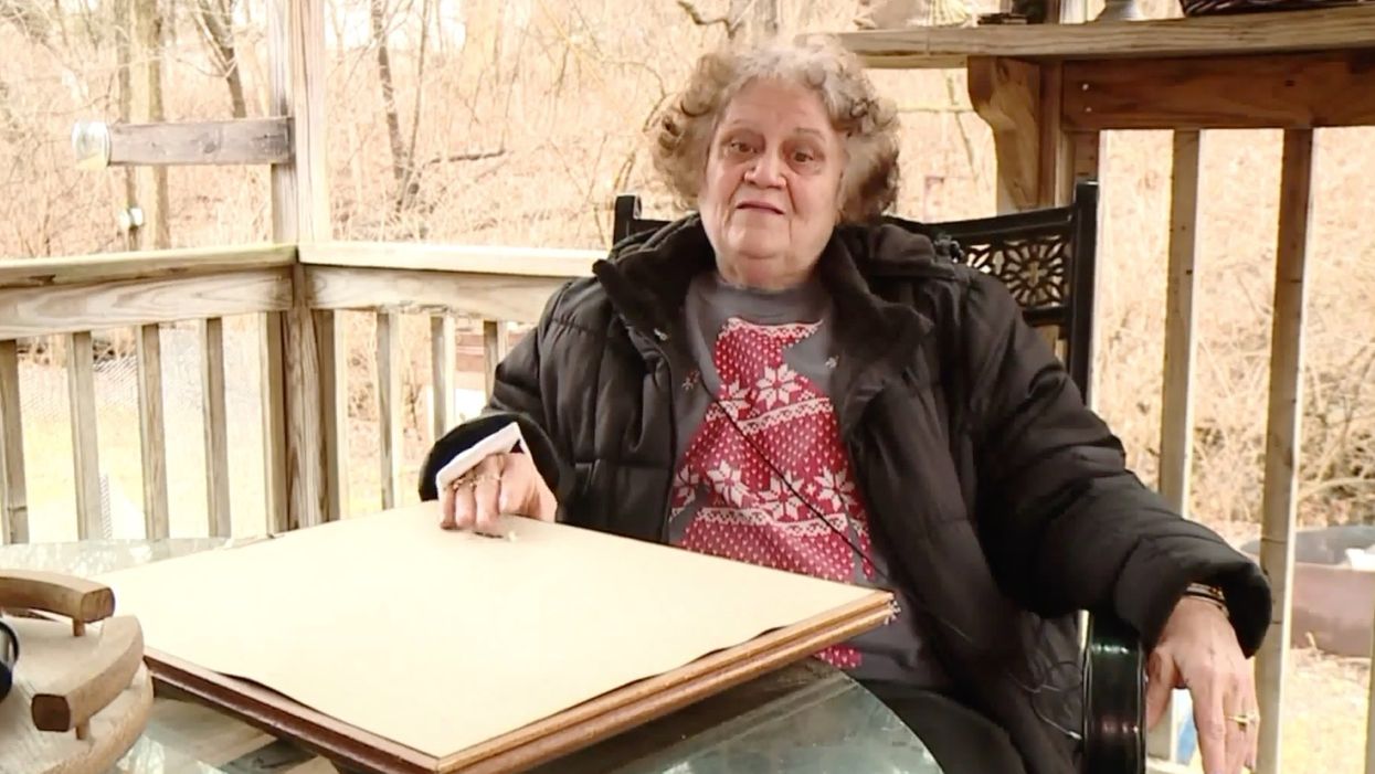 Woman says framed picture of Lord's Prayer saved her from a bullet fired into the side of her home