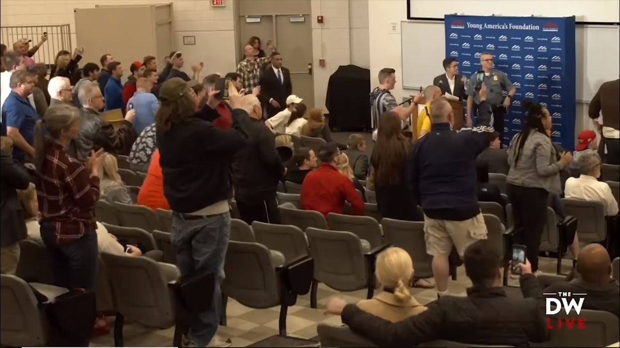 Protester rushes stage and throws 'bleach-like substance' at Daily Wire's Michael Knowles during a talk at a university