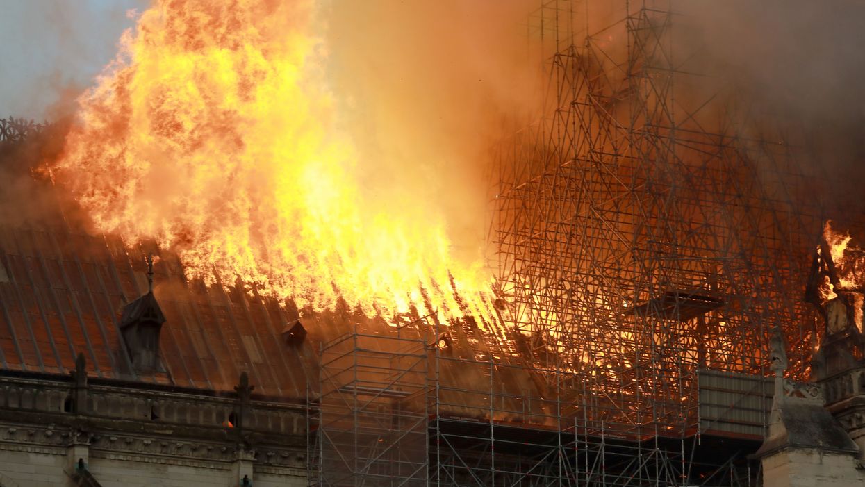 Firefighters scale scaffolding at burning Notre Dame Cathedral to fight the flames