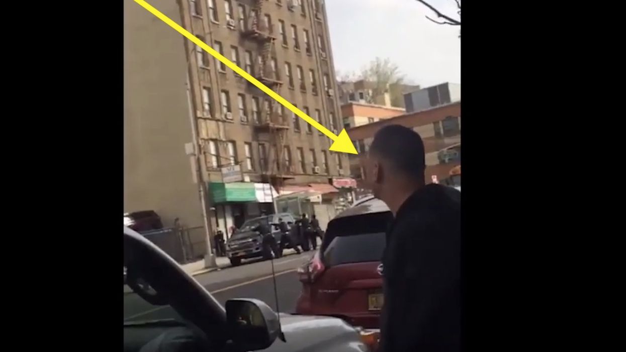 'F*** 'em! Shoot the cops!': Bystander caught on video egging on gang member in shootout with NYPD, wishing death upon officers