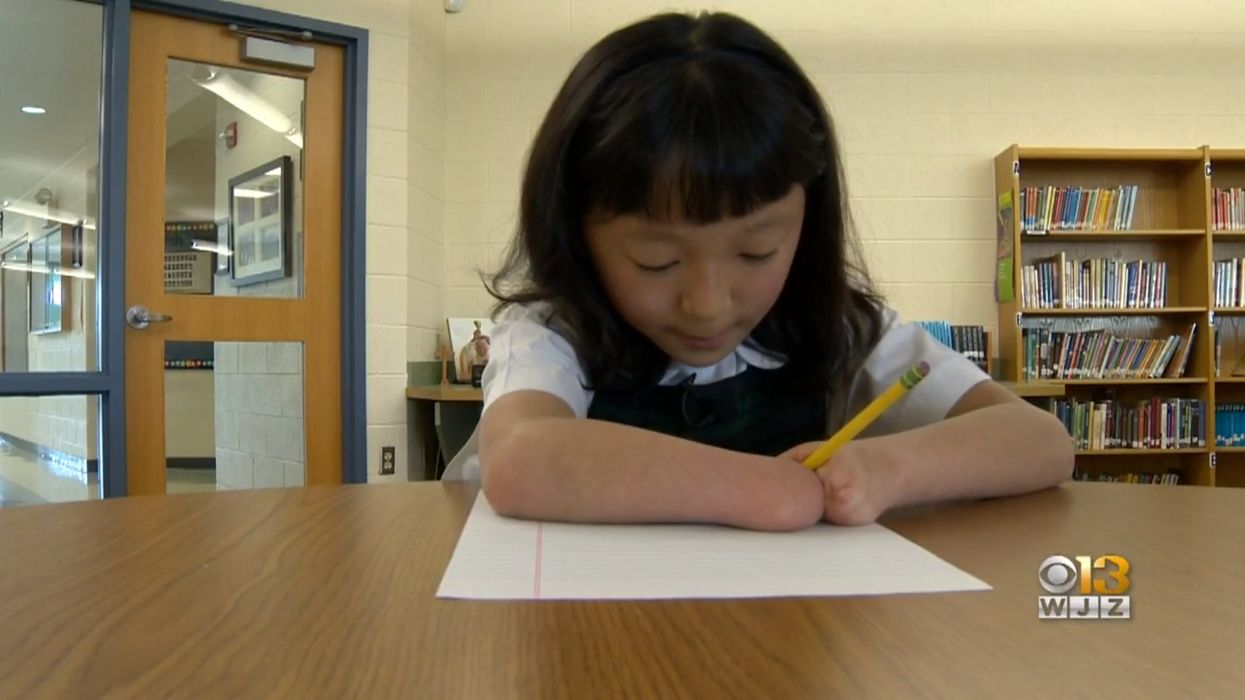 Young girl without hands wins national handwriting competition