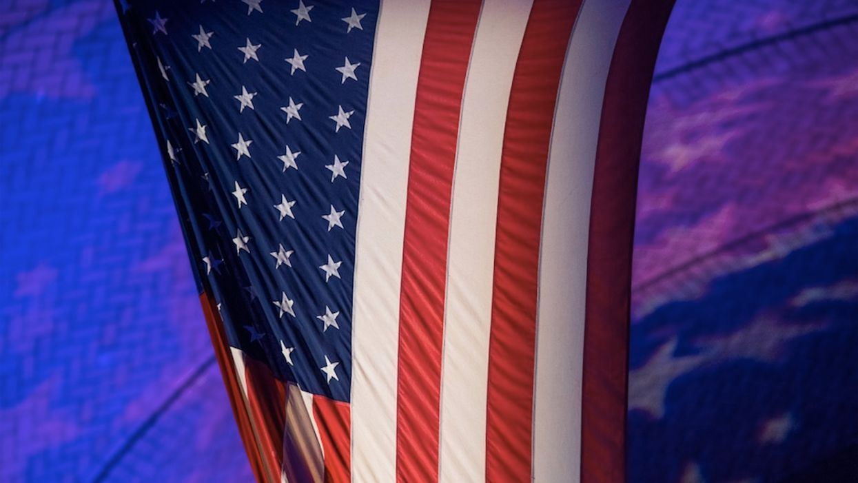 Atheist group complains 'God bless America' is said at elementary school after daily pledge. District quickly falls in line.