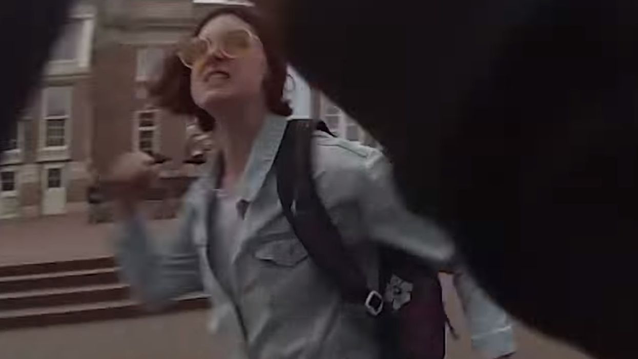 Female activist caught on video going berserk, getting violent during peaceful, pro-life demonstration. The pro-lifer responds in the most loving way.