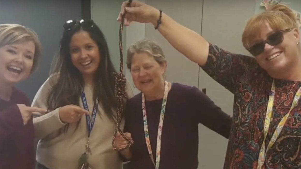 Elementary school teachers in hot water after image surfaces of them smiling around noose in classroom