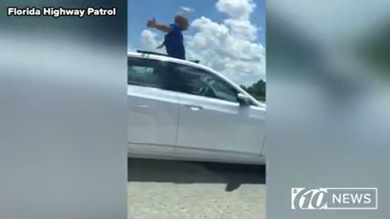 Florida man caught cruising while standing out of sunroof tells troopers he'd rather go to jail than home to his wife