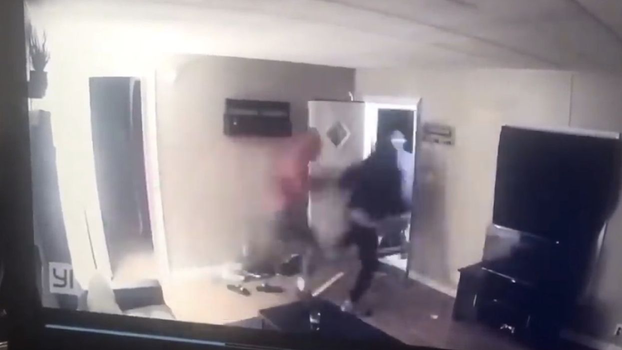 WATCH: Four armed men bust down door in home invasion — then suddenly change their minds when homeowner opens fire