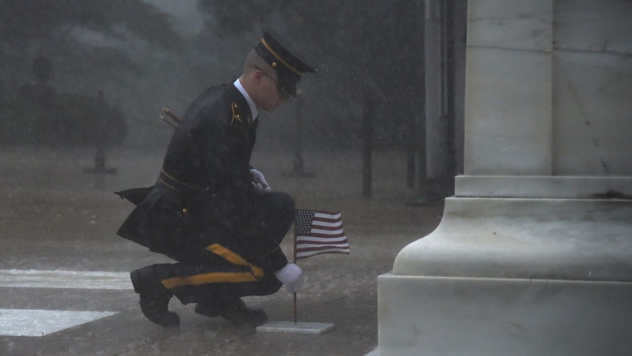 Here's the story behind the viral photo of soldier placing flag at Tomb of Unknown Soldier during storm