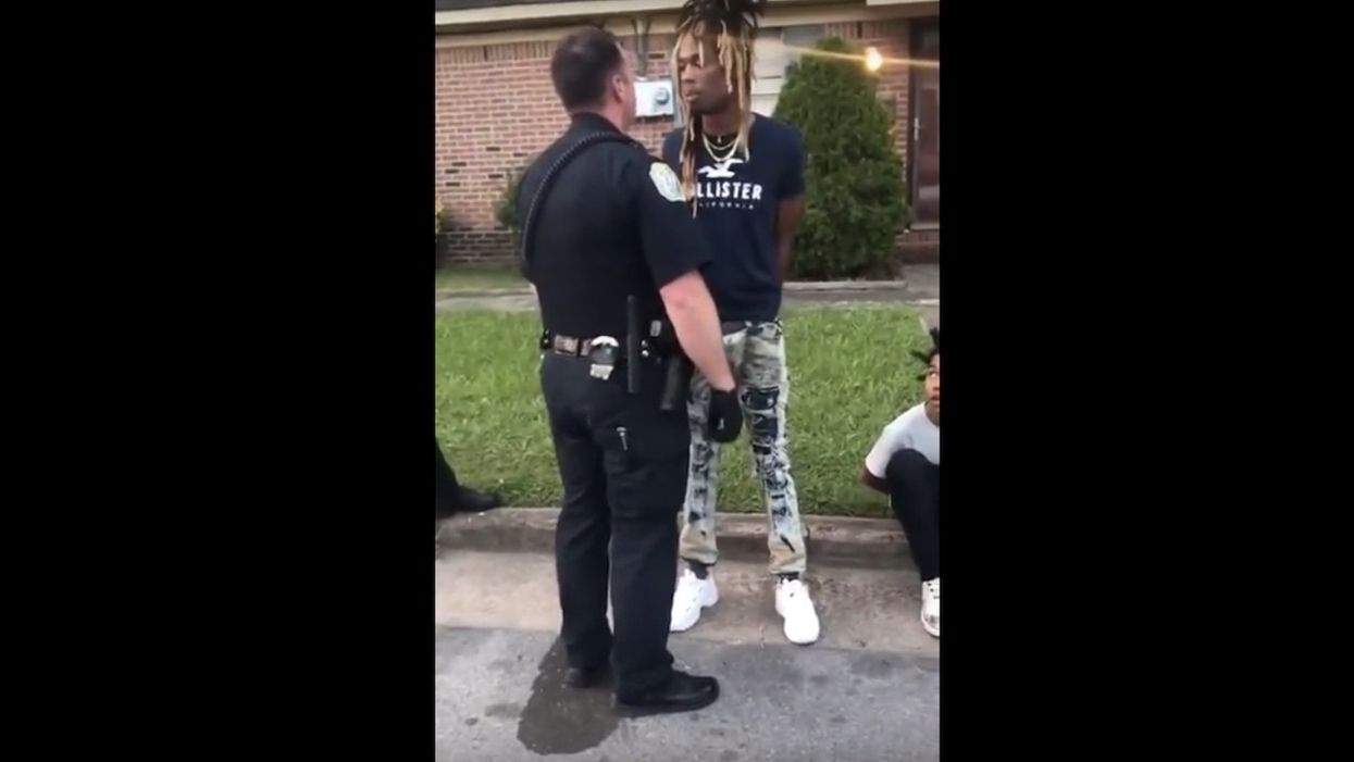 Handcuffed man asks police officer for his name. Cop replies, 'F*** you's my name.' Video of confrontation goes viral.