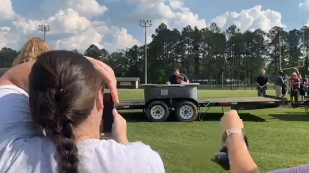 Atheist group objects after video reportedly shows 'several football players' baptized on public school property
