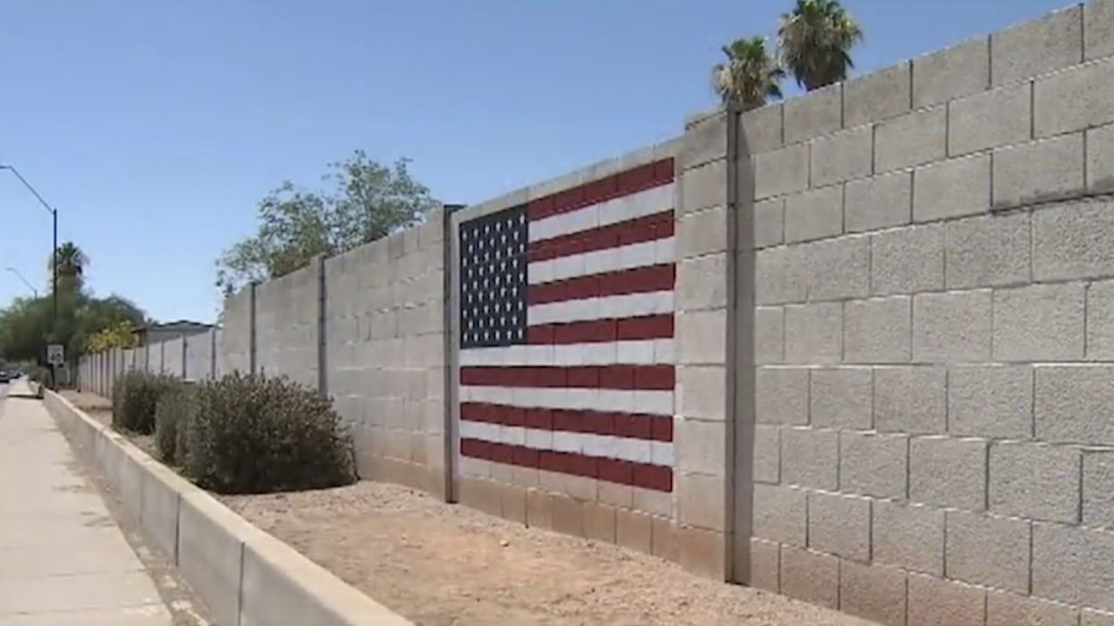 American flag mural, painted the day after 9/11, defaced with profane, anti-Trump graffiti. But two cops and a kid come to the rescue.