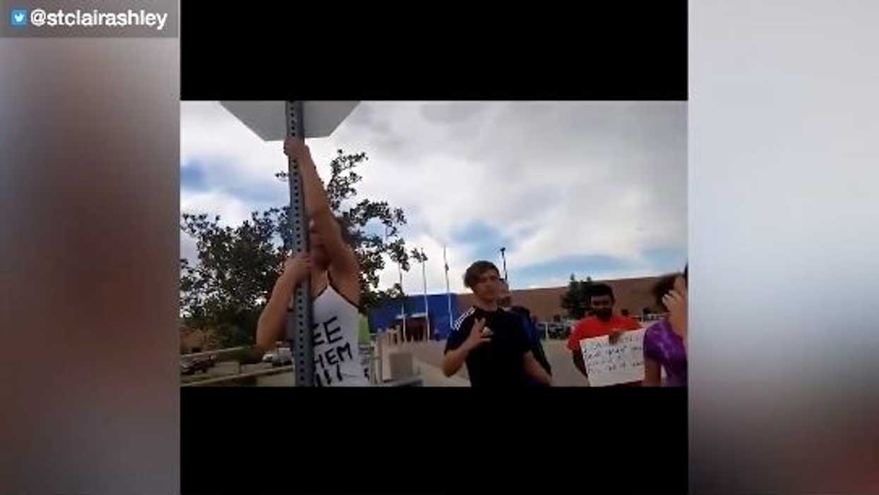 Leftist is triggered by the American flag and the troops at Aurora ICE facility