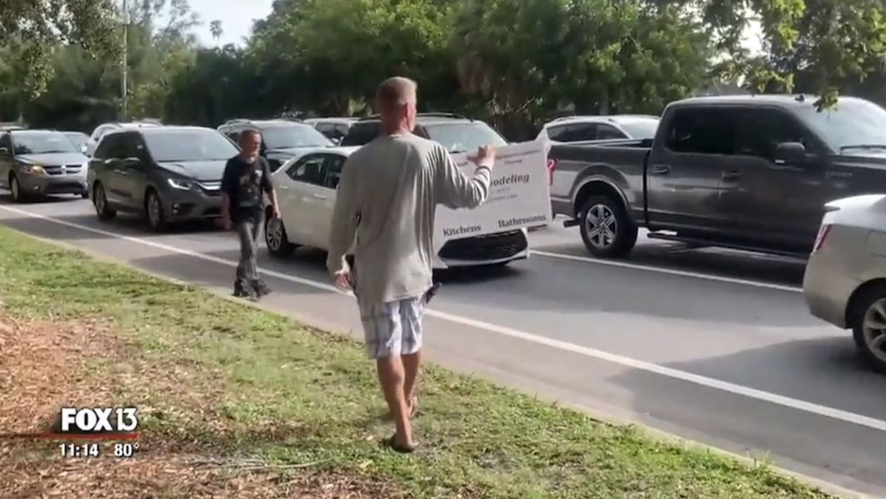 After panhandler refused man's offer of money for work, the man returned with his own sign: 'I offered him $15 an hour to do yard work'