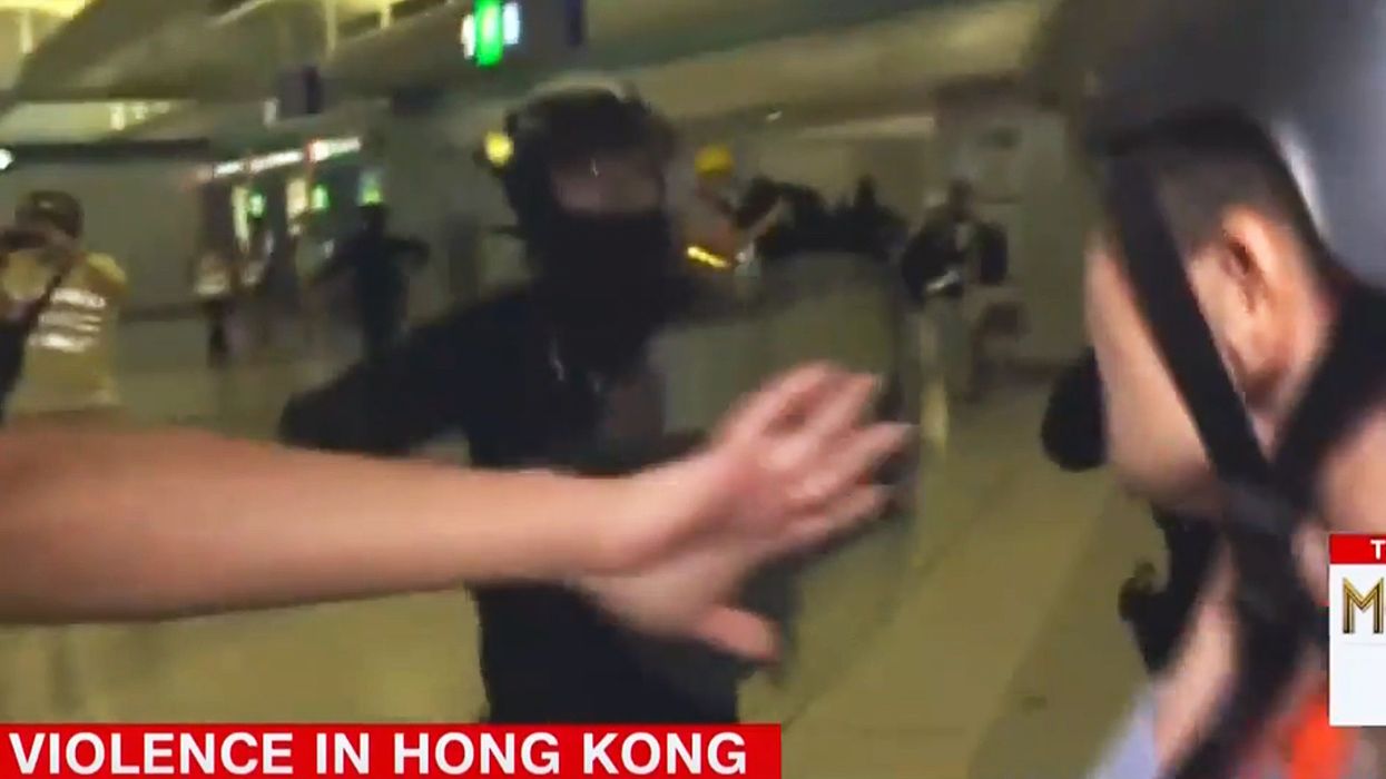'PANDEMONIUM': Dramatic footage as CNN crew is caught between police and protesters in violent clash
